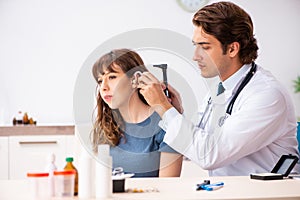 The patient with hearing problem visiting doctor otorhinolaryngologist photo