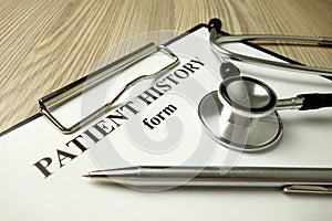 Patient history form with pen and stethoscope