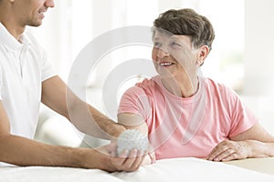 Patient holding spiked rehabilitation ball