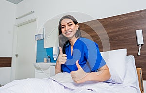 Patient in a hospital bed. Young caucasian woman.