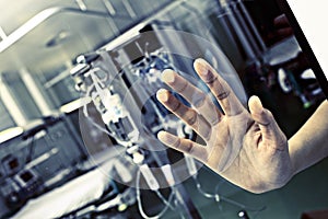 Patient in hospital pressed his hand to the glass