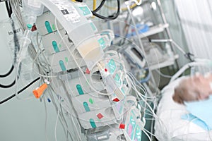 Patient on intensive care connected to devices for perfusion of