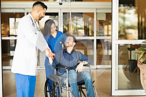 Patient leaving the hospital on a wheelchair