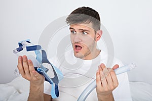 Patient Looking At CPAP Machine