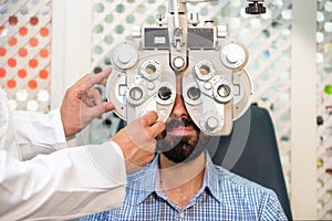 Patient in modern ophthalmology clinic checking the eye vision.