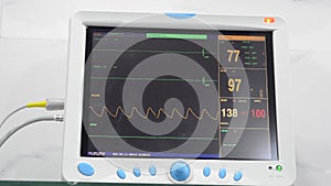 Patient monitor displays vital signs of EKG