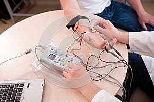 Patient nerves testing using electromyography at medical center