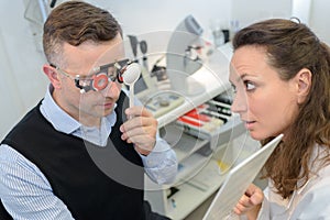 patient on optometrist eye test with eye chart