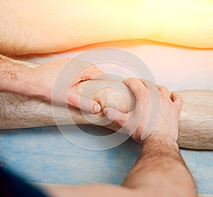 Patient with orthopedist doctor in his office.