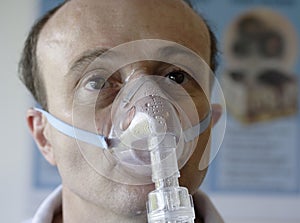 Patient in an oxygen mask