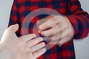 A patient with Parkinson`s disease has trembling hands. Tremor of the extremities in various diseases. Close-up of a shivering ma