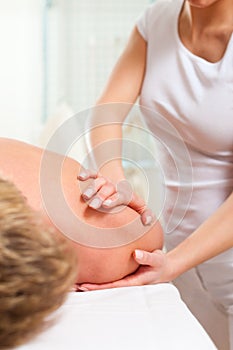 Patient at the physiotherapy - massage photo