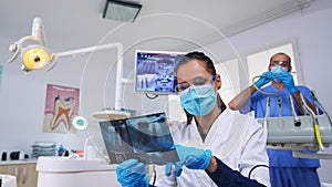 Patient pov in dental office planning surgery looking at x-ray