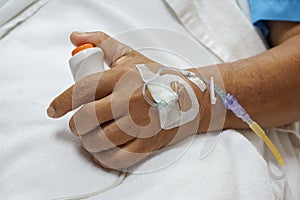 Patient pressing a button for emergency help