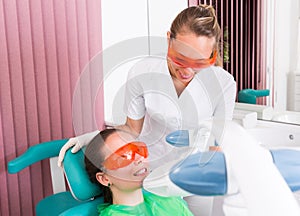 Patient at procedure of teeth whitening