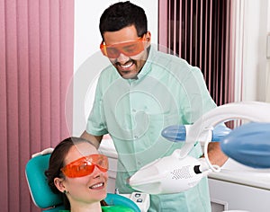 Patient at procedure of teeth whitening