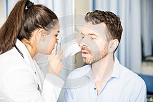 Patient`s eyes being examined by doctor