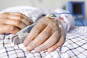 The patient's hand on the bed