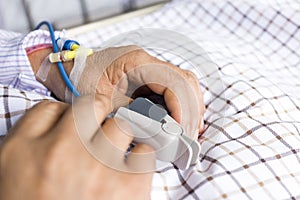 The patient's hand on the bed