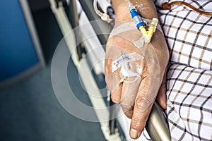 The patient's hand on the bed