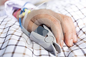 The patient's hand on the bed