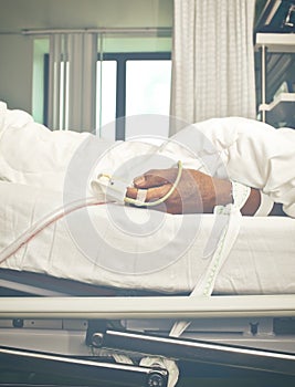 Patient`s hand tied to the bed