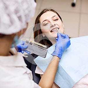 Patient`s teeth shade with samples for bleaching treatment.