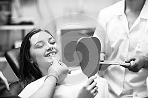 Patient`s teeth shade with samples for bleaching treatment.