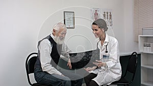 Patient smiling while doctor telling results of mri.