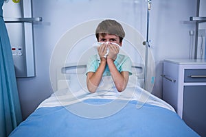Patient sneezing his nose in ward