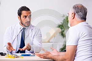 Patient suffering from diabetes visiting doctor