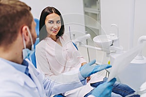 Patient talking with dentist looking at x-ray