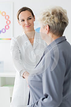Patient thanking smiling dietician photo