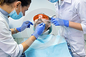 Patient and two dentists.