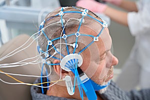 Patient undergoing an EEG encephalography diagnostic procedure