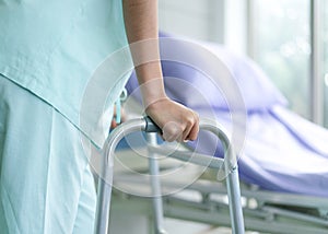 Patient use a walker after accident and cures