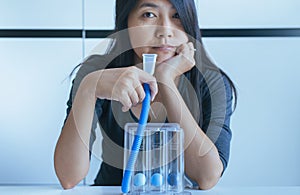 Patient using incentive spirometer or three balls for stimulate lung