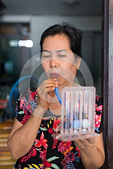 Patient using incentivespirometer or three balls for stimulate lung