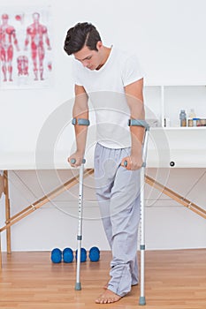 Patient walking with crutch