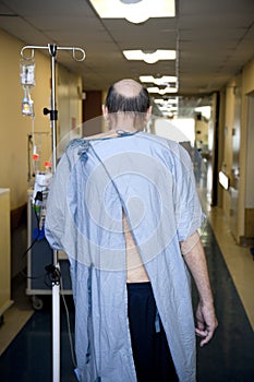 Patient walking down the hospital floor