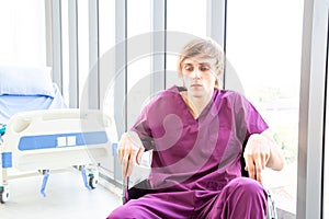Patient was disheartened or hopeless, sitting on a wheelchair in the patient room