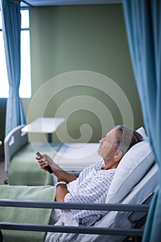 Patient watching television on the bed