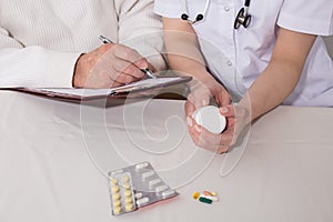 Patient writing dosage of medicines
