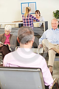 Patients In Doctor's Waiting Room