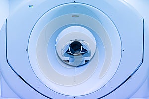 Patients screening on CT scanner. Man Undergoing CT Scan While Doctor`s Using Computers. Examining man in CT scanner. Computer use