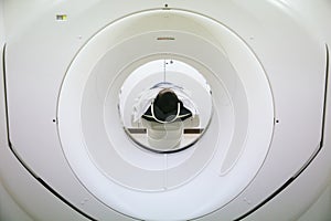 Patients screening on CT scanner. Man Undergoing CT Scan While Doctor`s Using Computers.