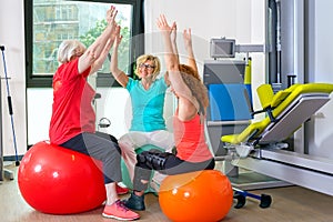 Patients on stability balls doing exercises