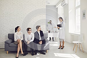 Patients in the waiting room are waiting for a practitioner at the clinic.