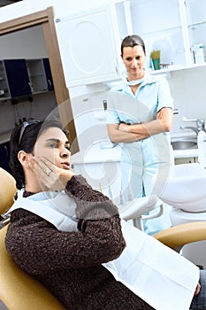 Patinet and dentist assistant