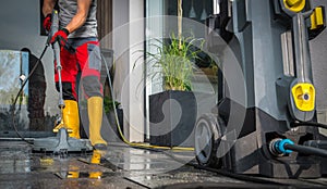 Patio Concrete Bricks Surface Cleaning Using Powerful Pressure Washer